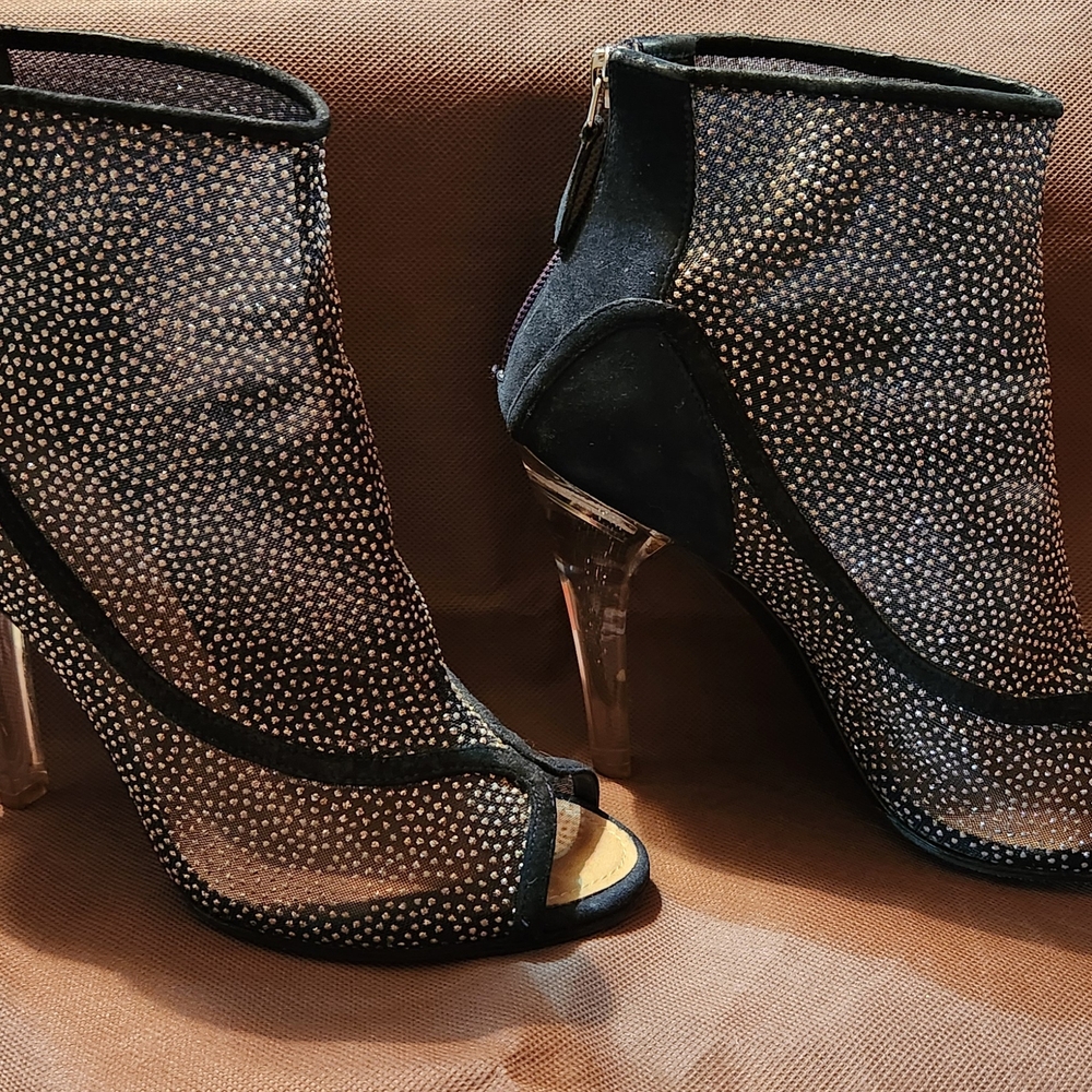 CHANEL Black Heeled Boots with Textured Elegance